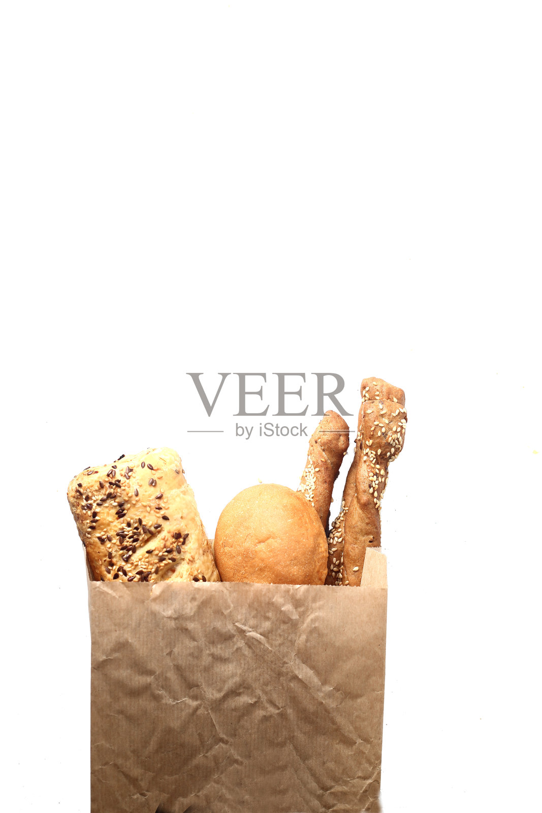 面包装在纸袋里，孤立在白色的背景上平铺照片摄影图片