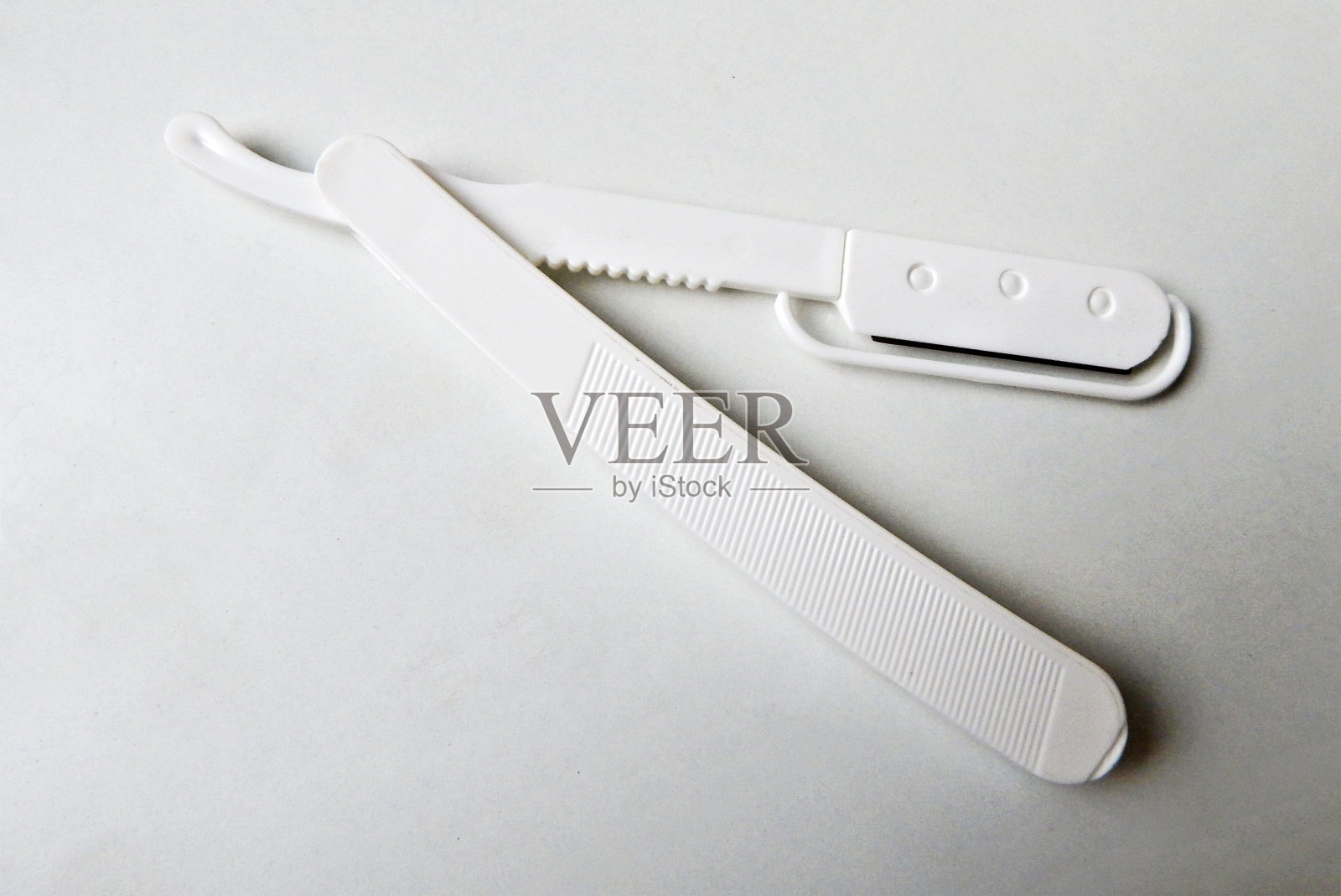 塑料男人剃须剃须刀孤立在白色背景照片摄影图片