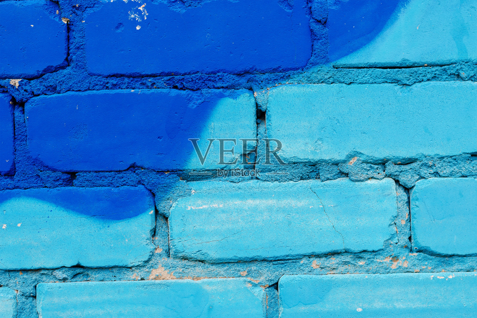 蓝色砖墙的特写。外墙的碎片照片摄影图片