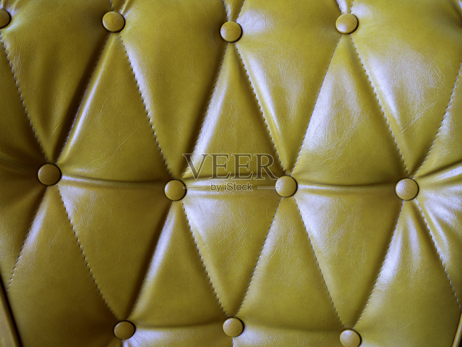 真皮沙发与别针和钮扣纹理。照片摄影图片