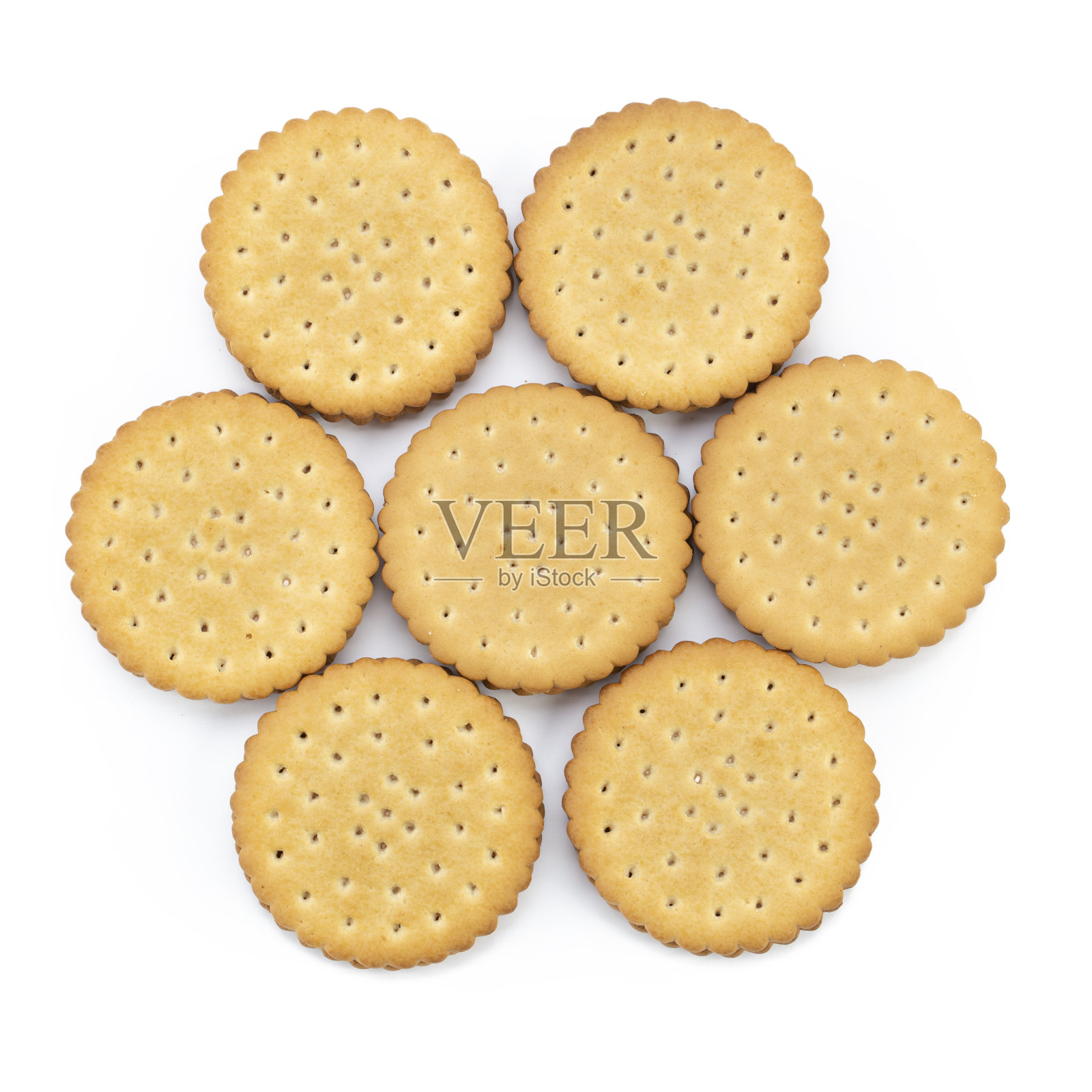 白色背景上有馅的圆形美味饼干。照片摄影图片