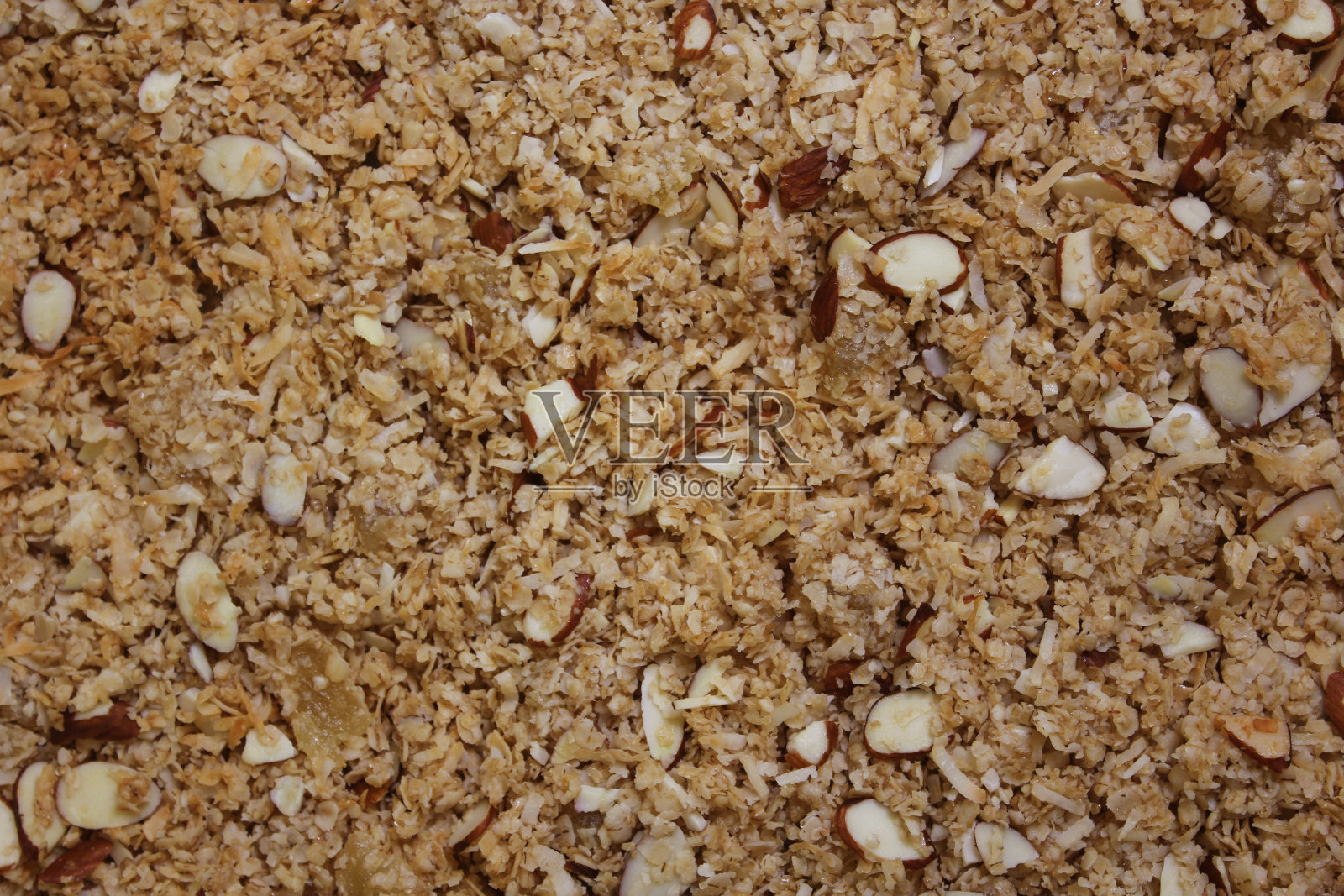 特写背景图像的有机格兰诺拉与杏仁和椰子照片摄影图片