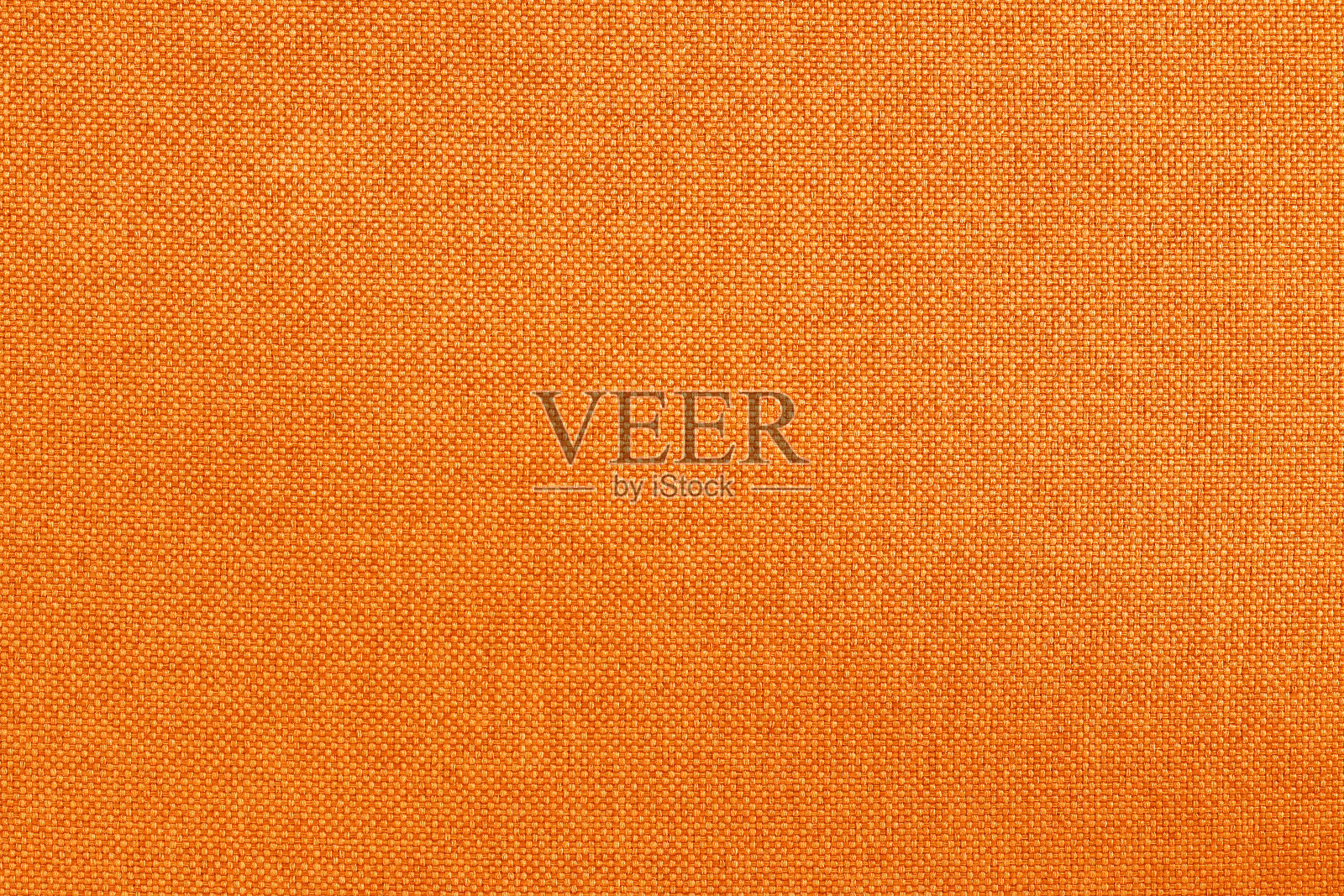 面料为橙色，布料质地为背景，花纹自然纺织。照片摄影图片