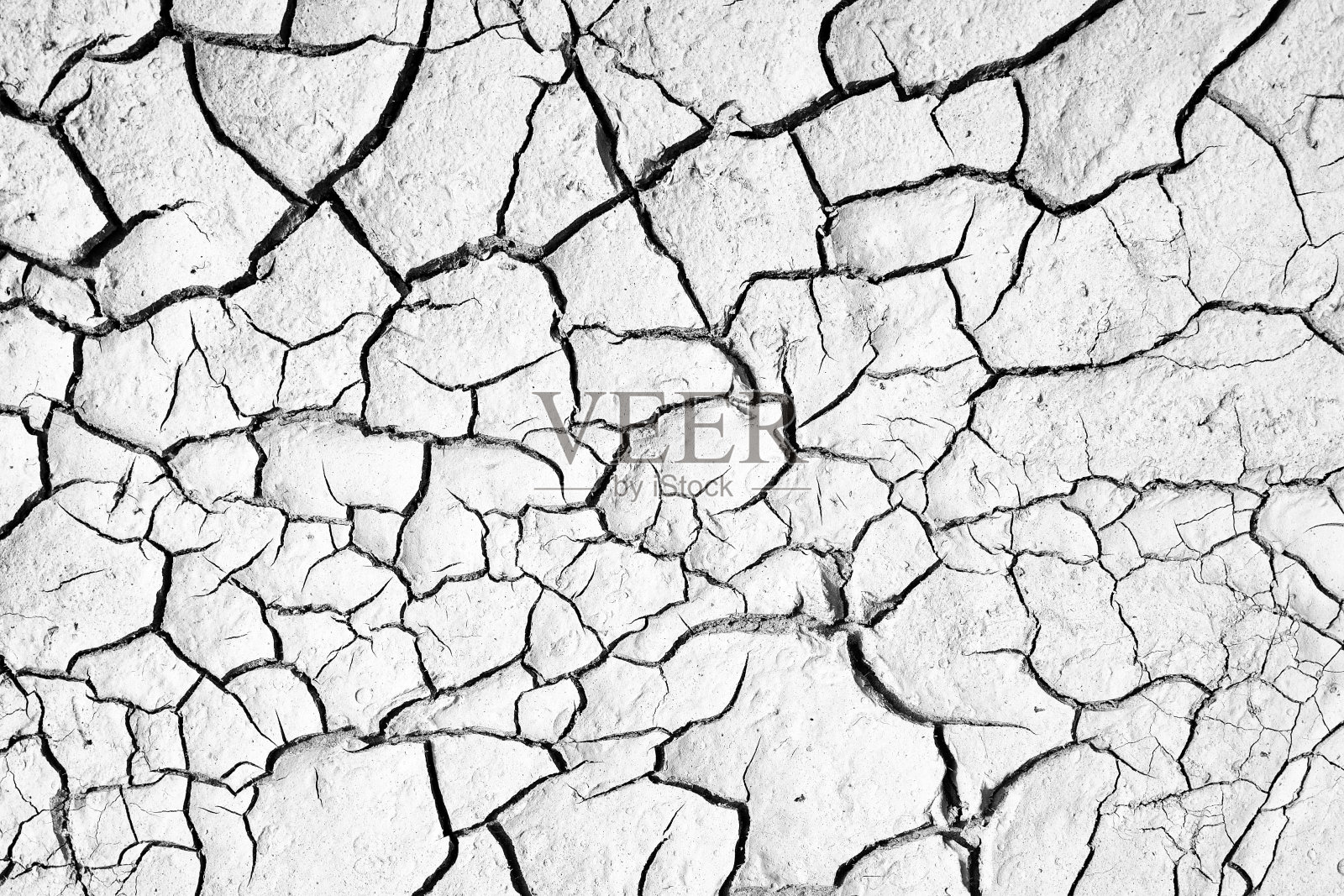 干旱地区，地面开裂。质地粗糙，干裂，焦土。照片摄影图片