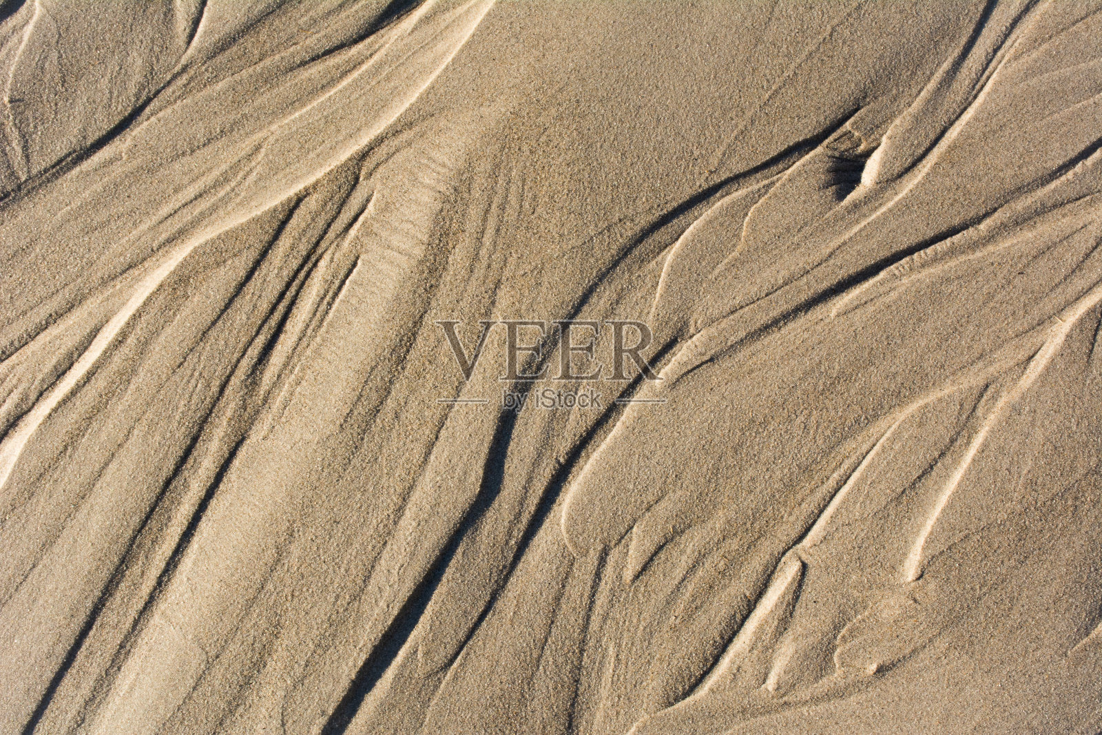 沙背景中的抽象流线照片摄影图片