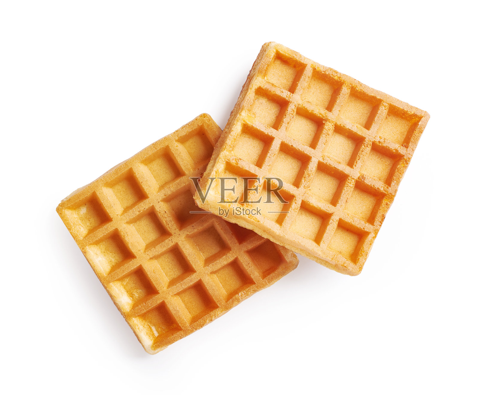 两块华夫饼放在白色的背景上。华夫饼的俯视图。照片摄影图片