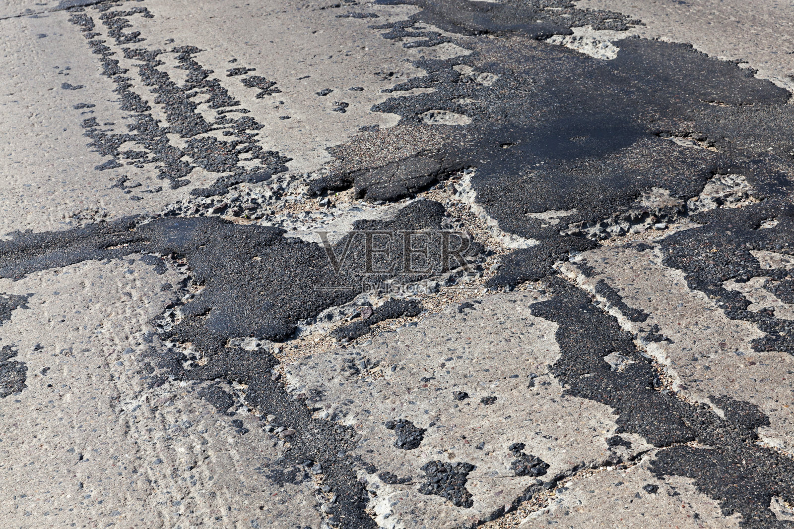 坑坑洼洼的糟糕的道路照片摄影图片
