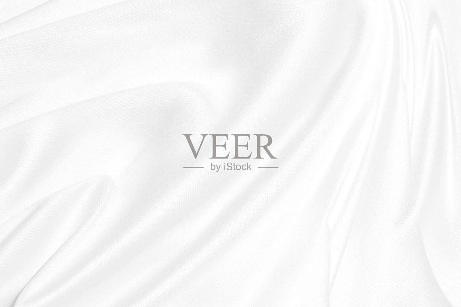 白色干净柔软的织物抽象光滑美丽的纹理。时尚面料自由风格造型装饰背景照片摄影图片