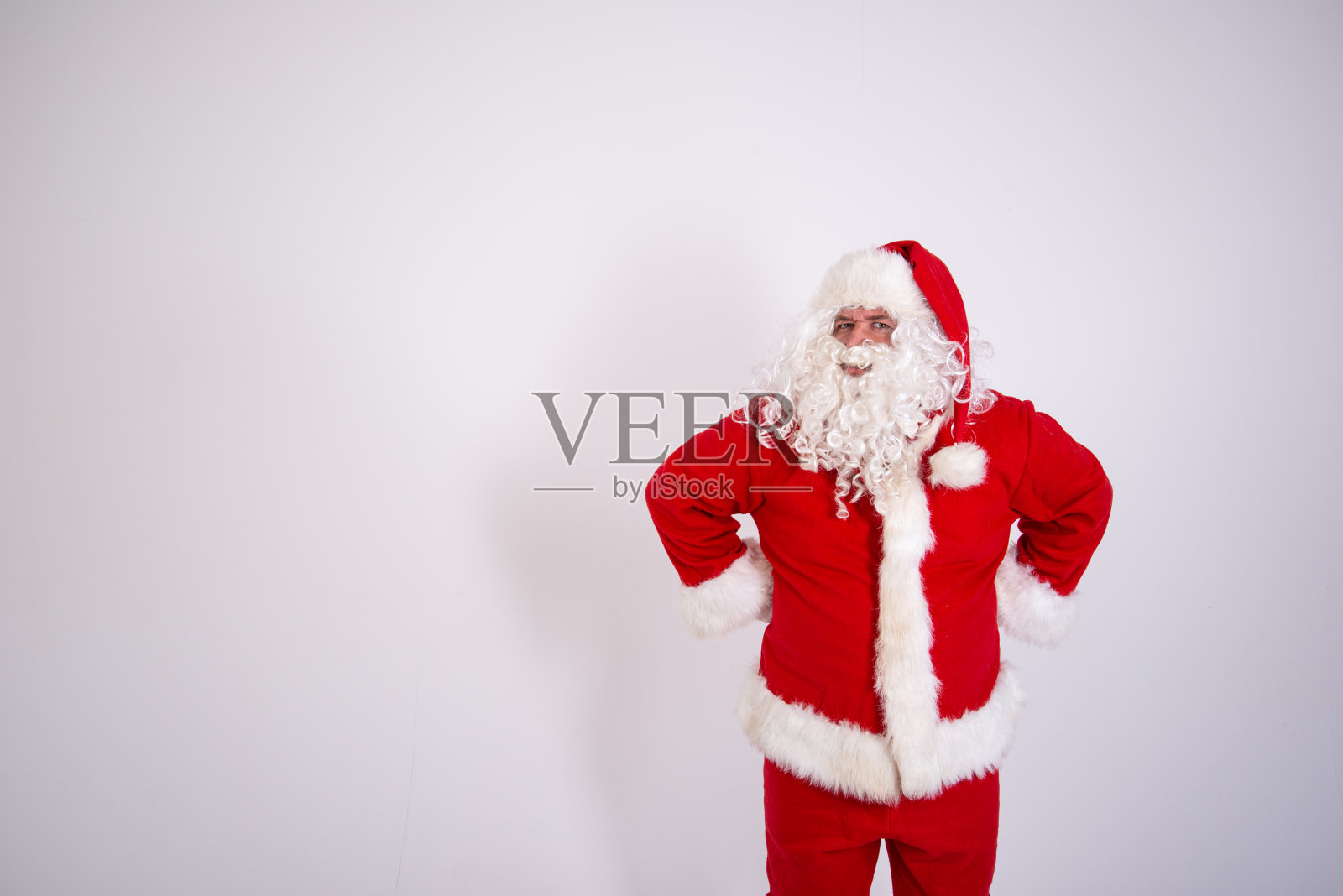 的情况。有趣的胖圣诞老人。照片摄影图片