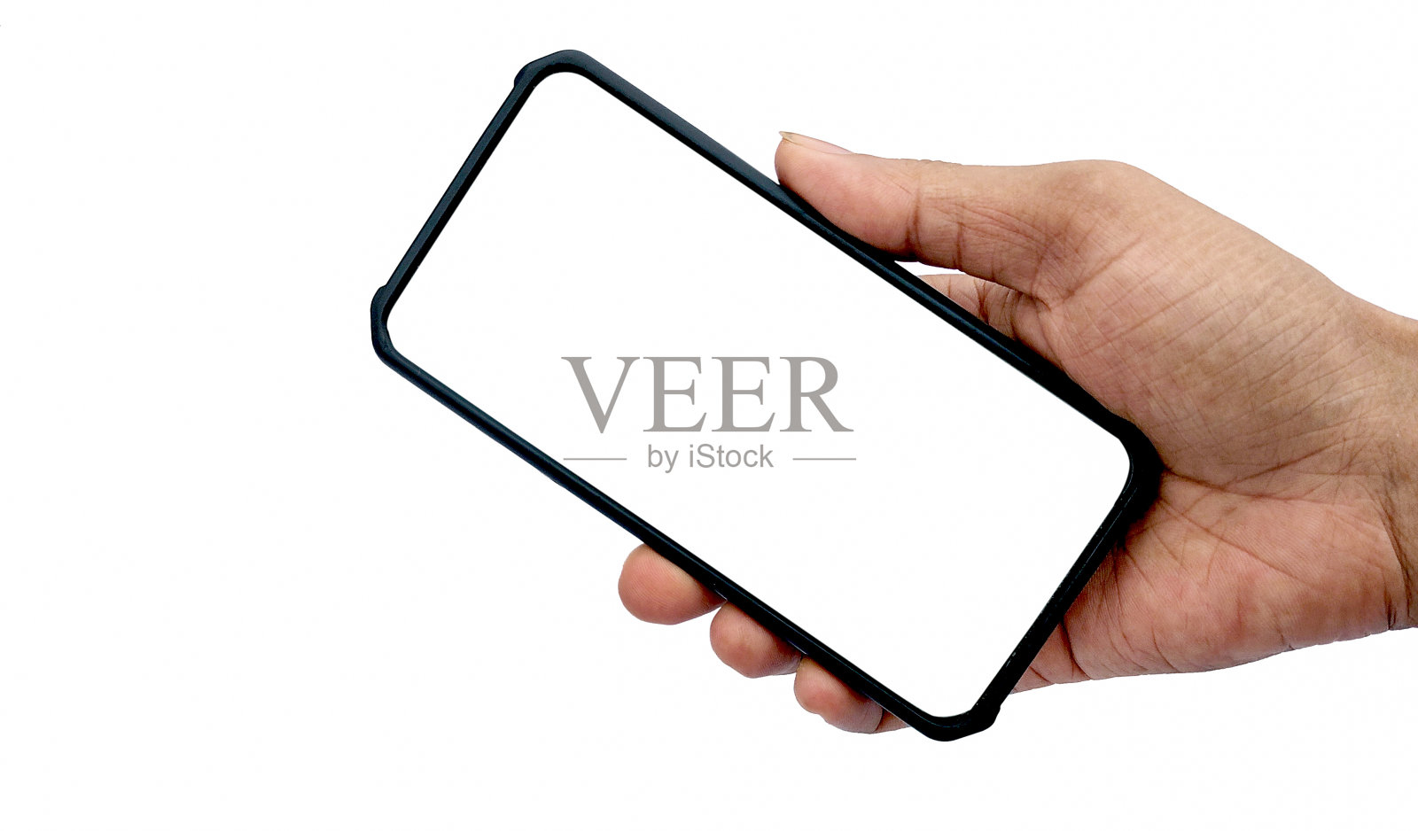 一名男子手持白底黑屏智能手机，手持特写。空间的文本照片摄影图片