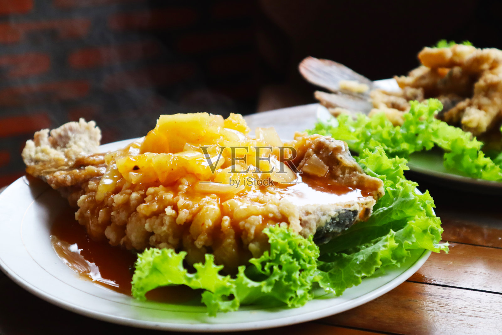 酸甜Gurame鱼照片摄影图片