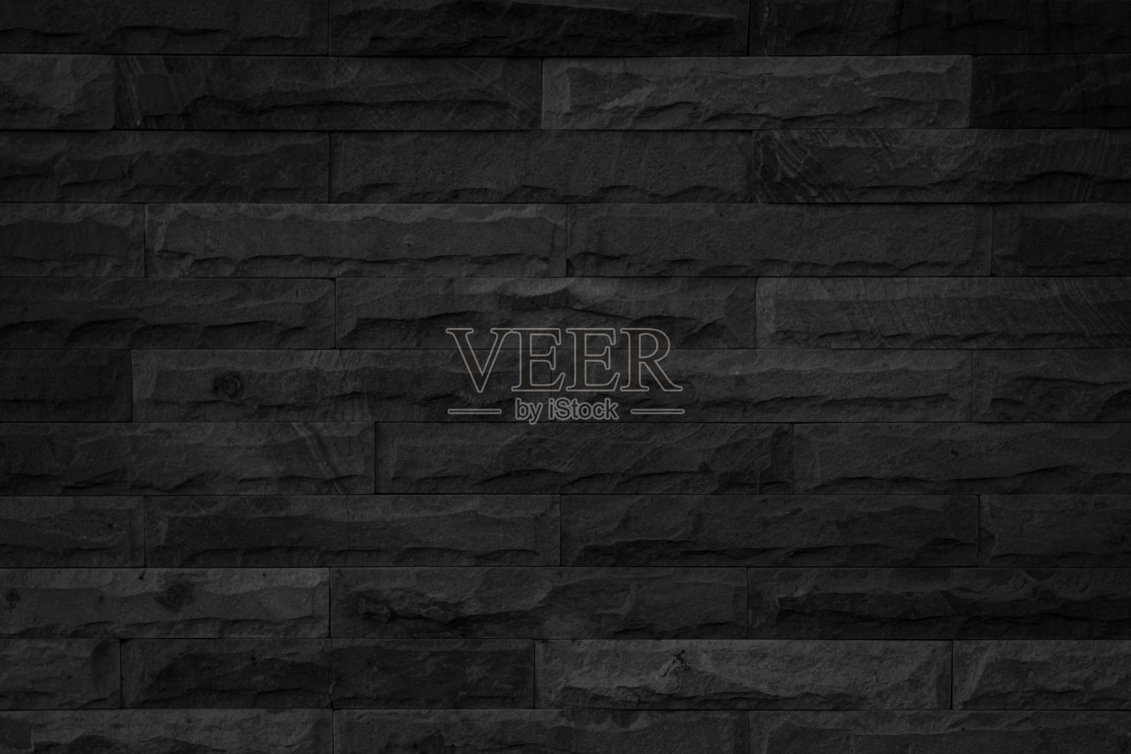 抽象暗砖墙面纹理背景图案，空砖墙面纹理。室内砖墙漆成黑色，旧的空白混凝土网格参差不齐，家居办公设计背景装饰。照片摄影图片