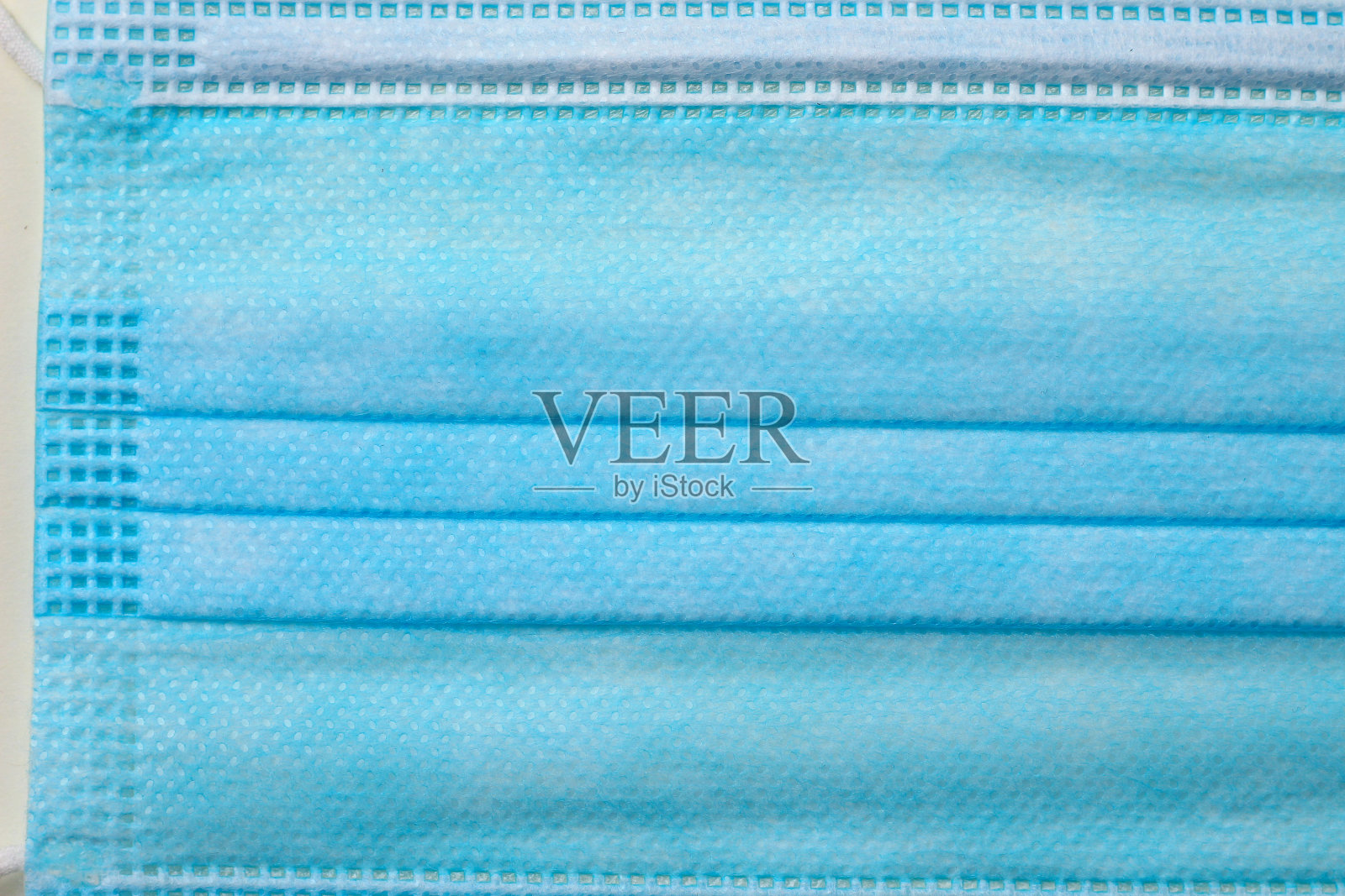 公共场所要求佩戴的医用外科口罩的特写纹理照片摄影图片