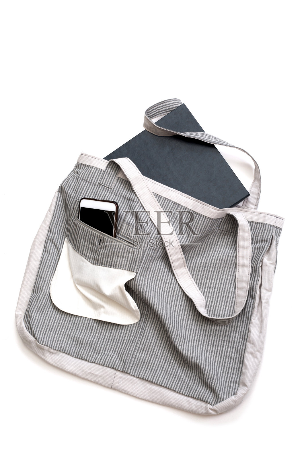 可重复使用的食品店环保袋，由白色背景的天然织物制成照片摄影图片