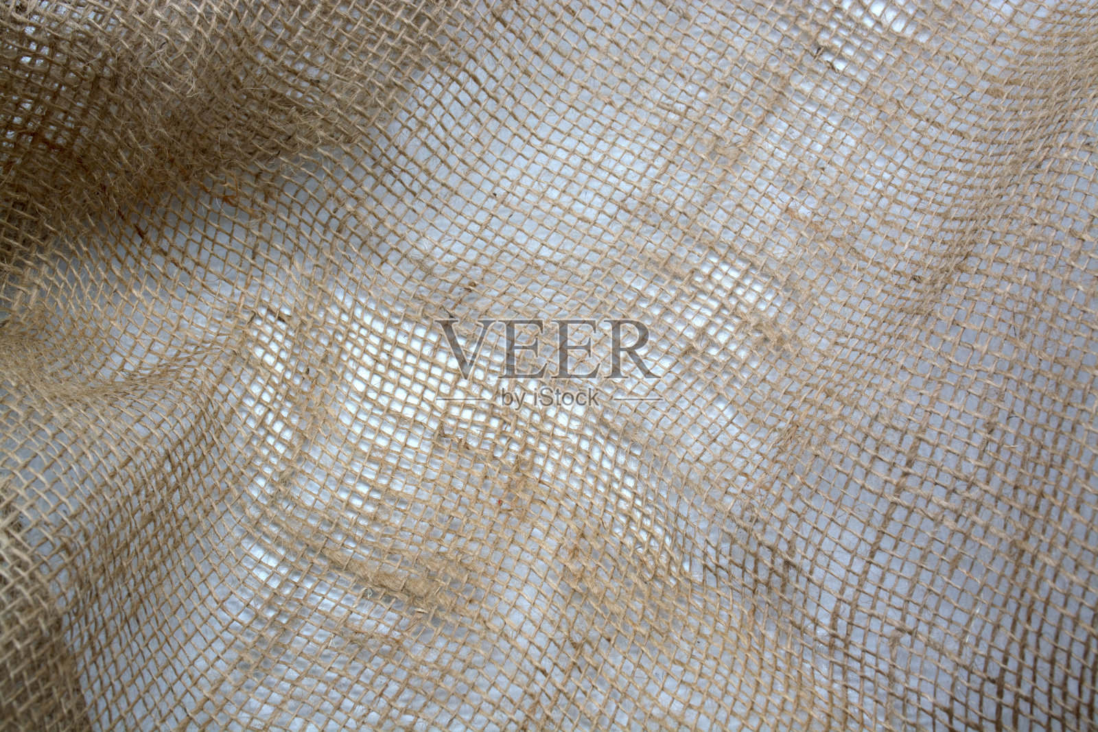 粗麻布皱巴巴的纹理背景棕色，编织，特写照片摄影图片
