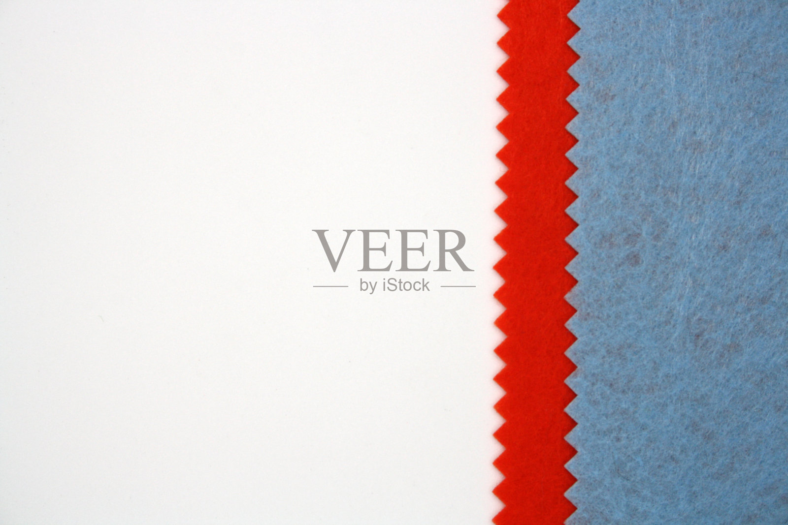 蓝色和橙色毛毡制成的织物背景。前视图。照片摄影图片