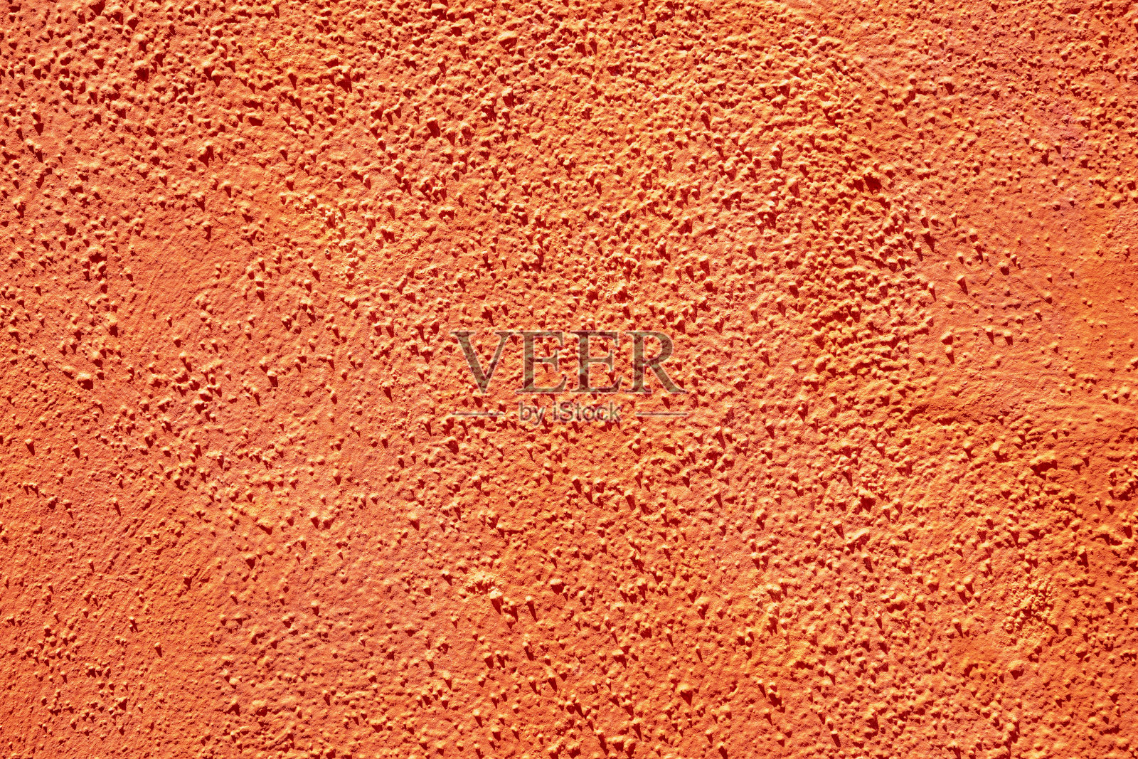 橘色粗糙的灰泥墙的细节照片摄影图片