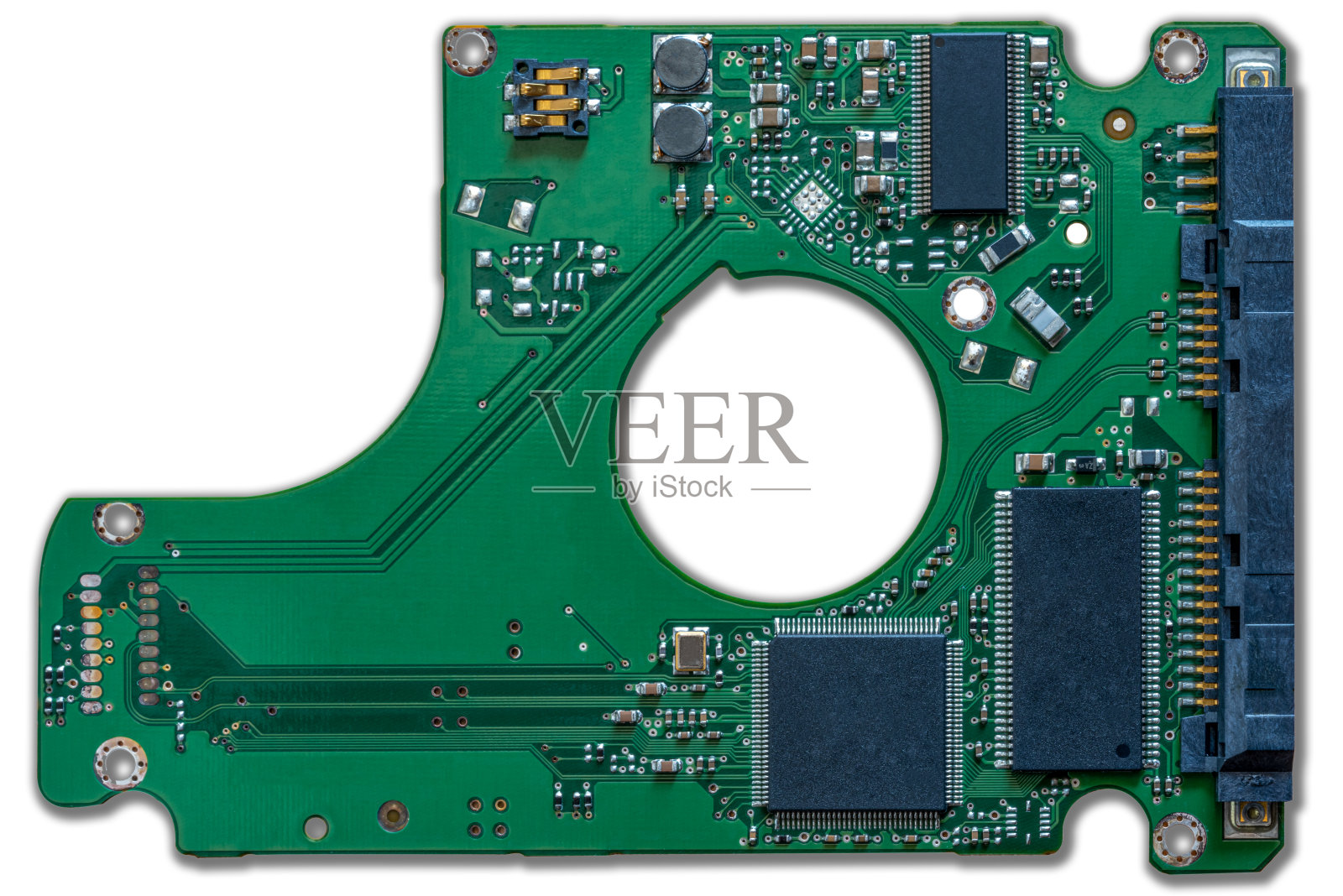 绿色机械硬盘电路板的局部特写照片摄影图片