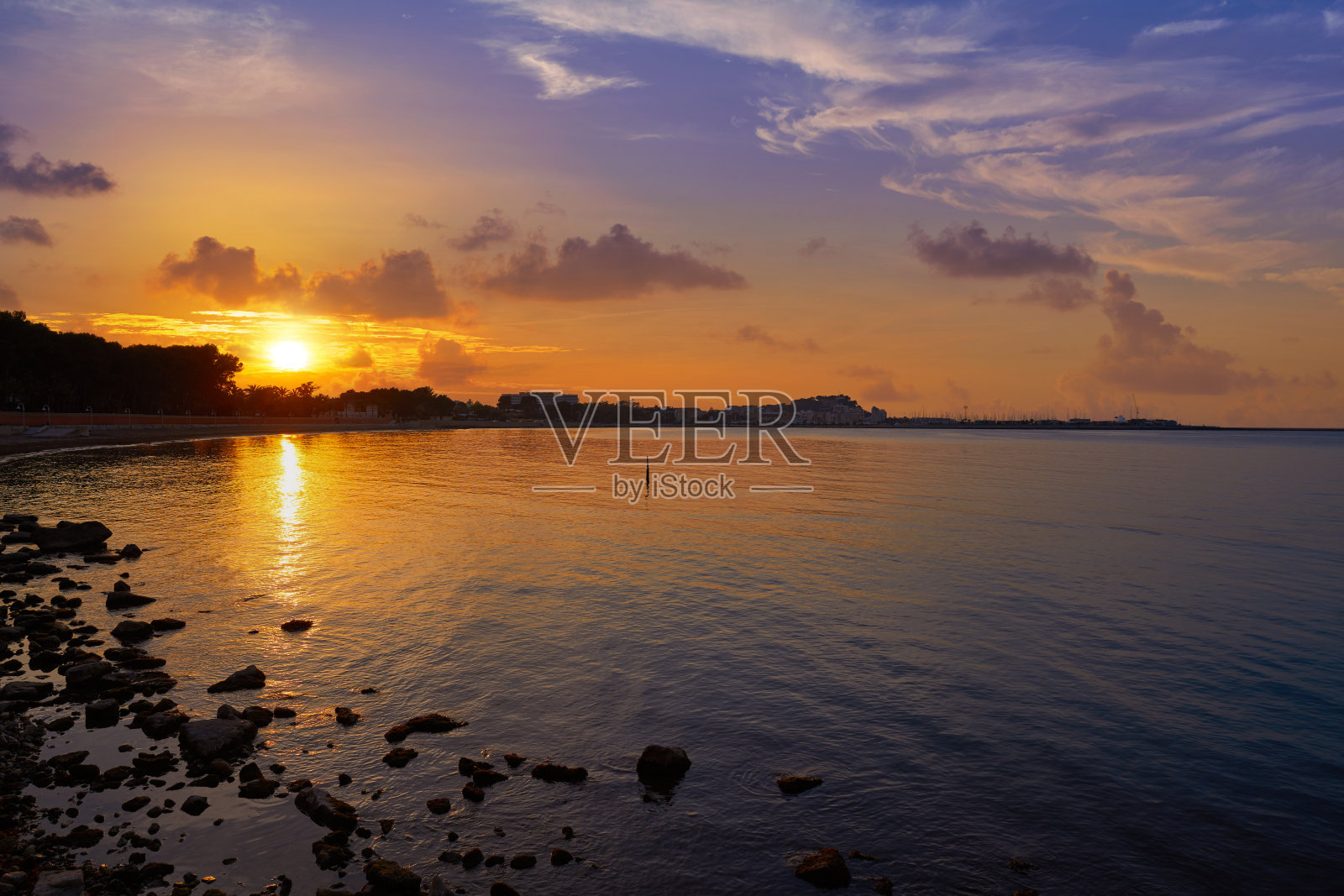 西班牙拉斯罗塔斯海滩的Denia日落照片摄影图片