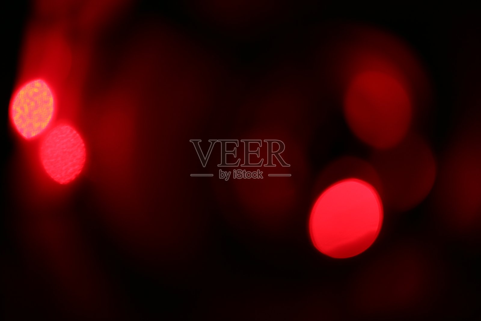 用红色散景模糊背景。照片摄影图片