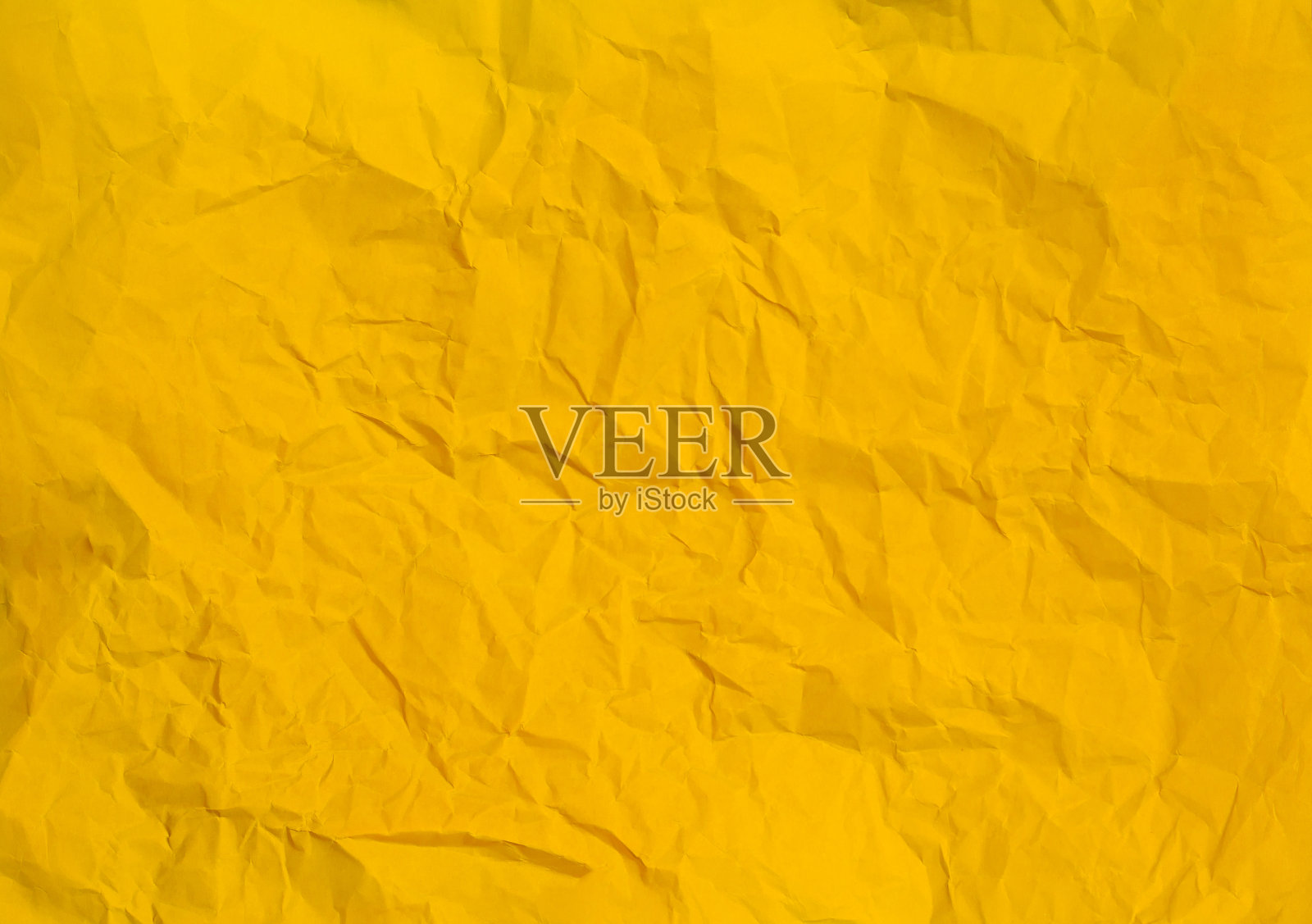 皱巴巴的黄色纸张背景纹理照片摄影图片
