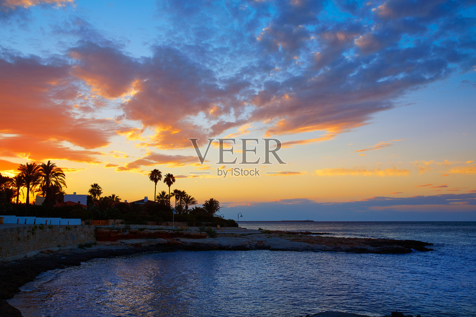 德尼娅日落拉斯罗塔斯在地中海西班牙照片摄影图片