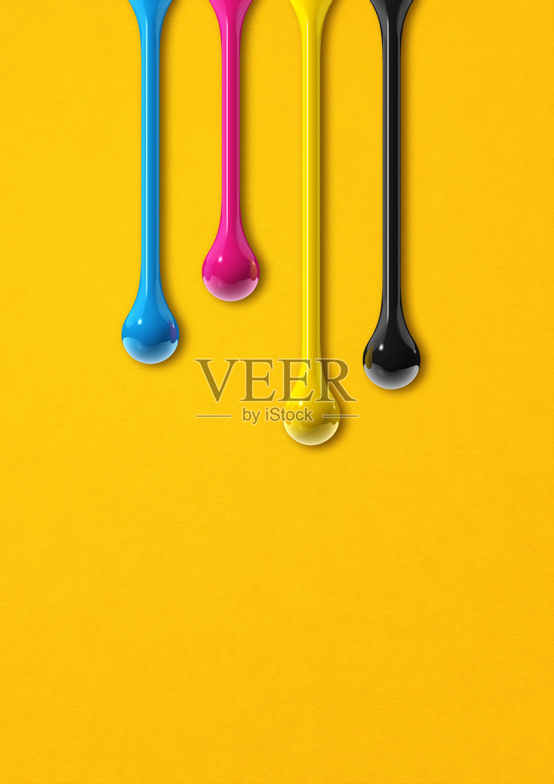 Cmyk墨水滴在黄色纸的背景上照片摄影图片