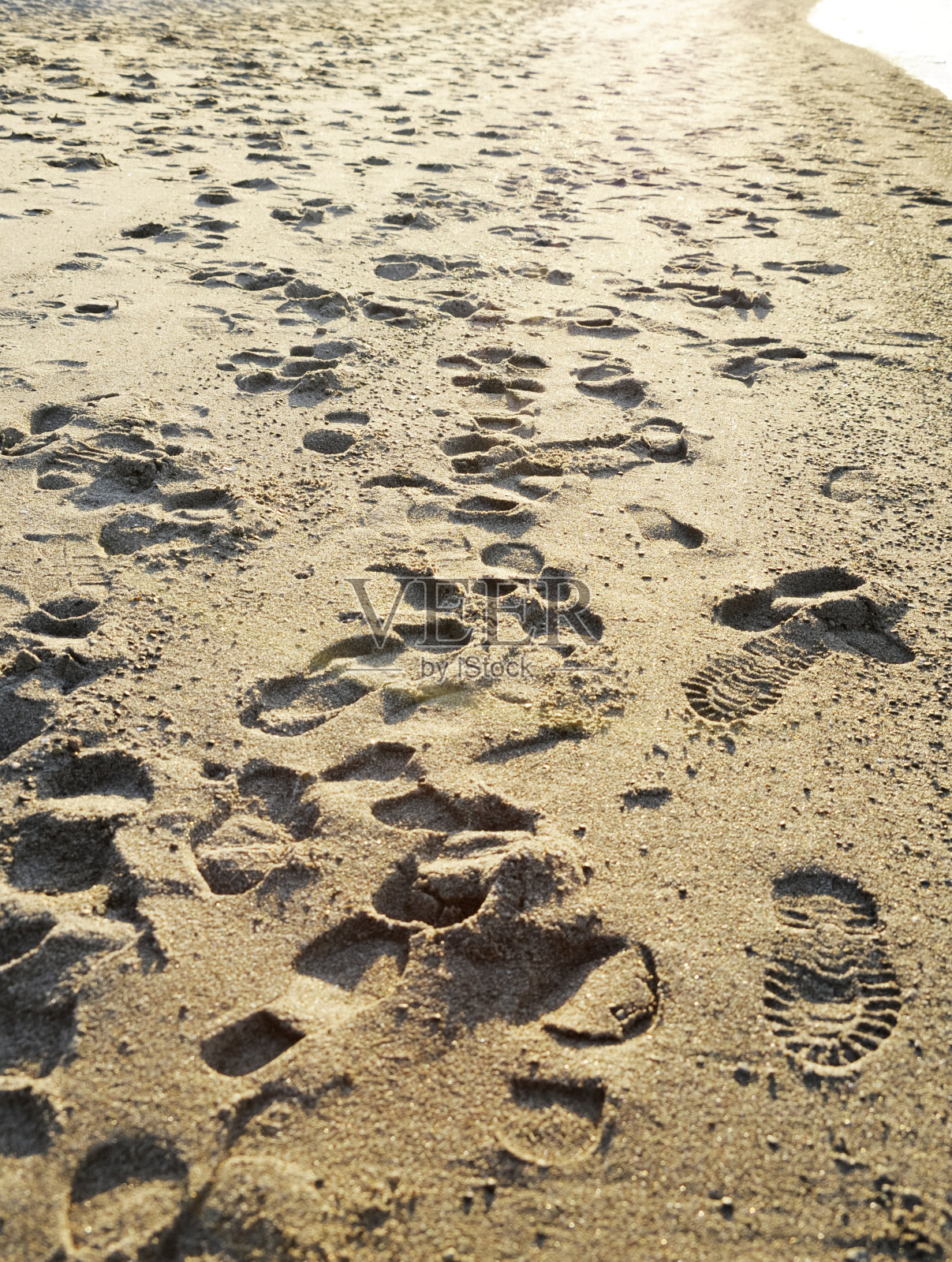 沙滩上的脚印照片摄影图片