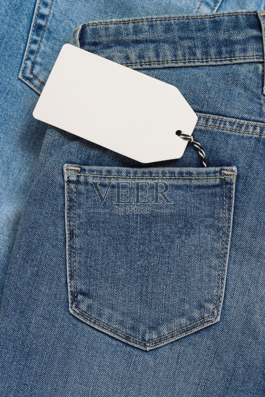 牛仔裤口袋里的价格标签照片摄影图片