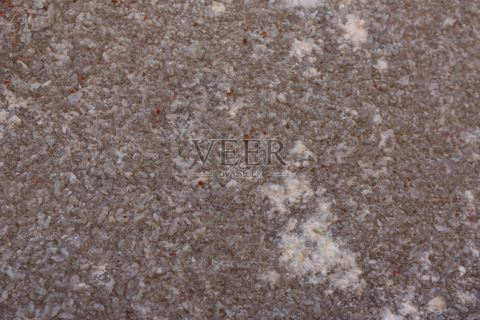 由天然石头建造的房子的旧立面的碎片照片摄影图片