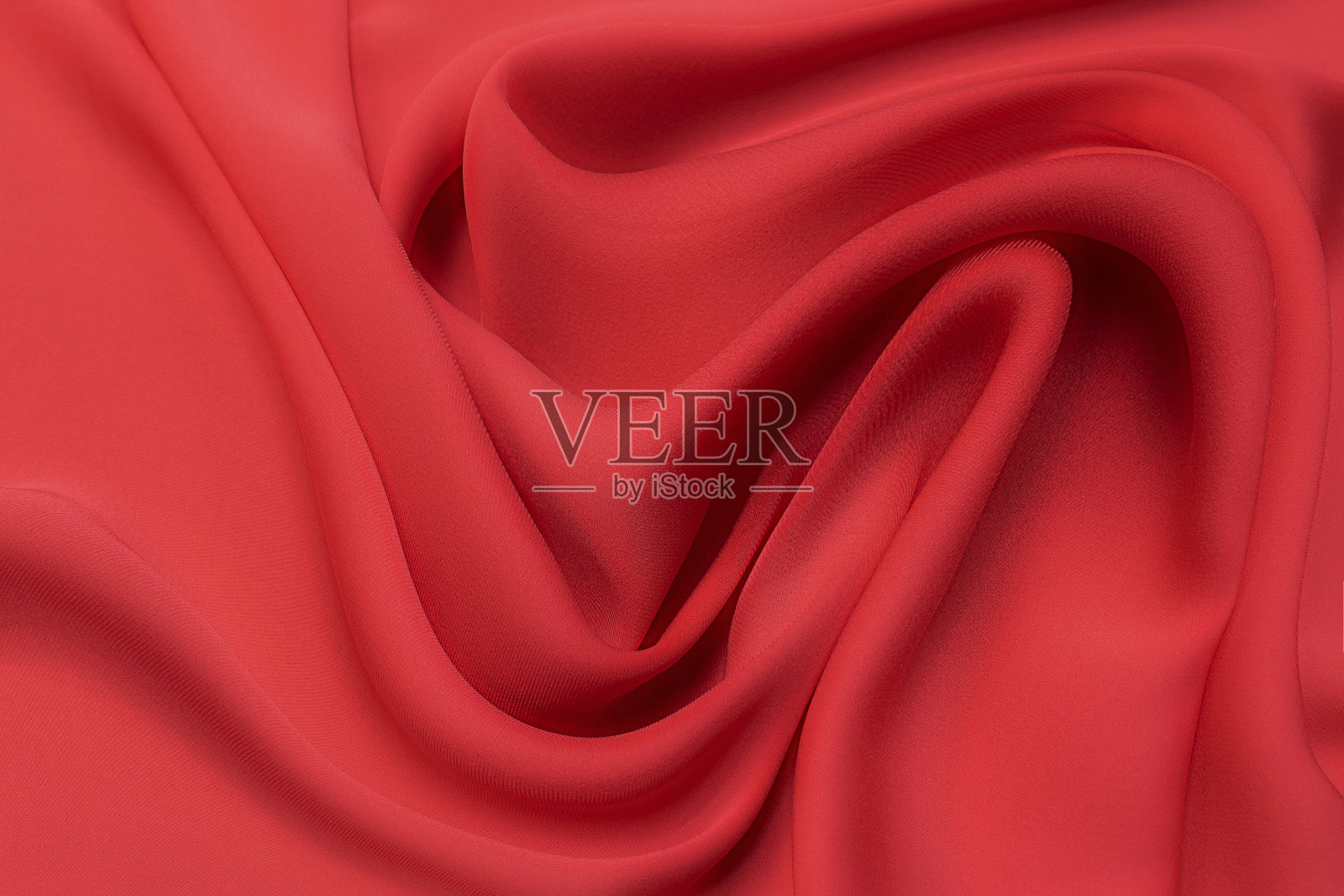 近距离纹理的自然红色或深红色或粉红色织物。天然棉、丝、毛或亚麻纺织材料的织物质地。红色和橙色的帆布背景。照片摄影图片