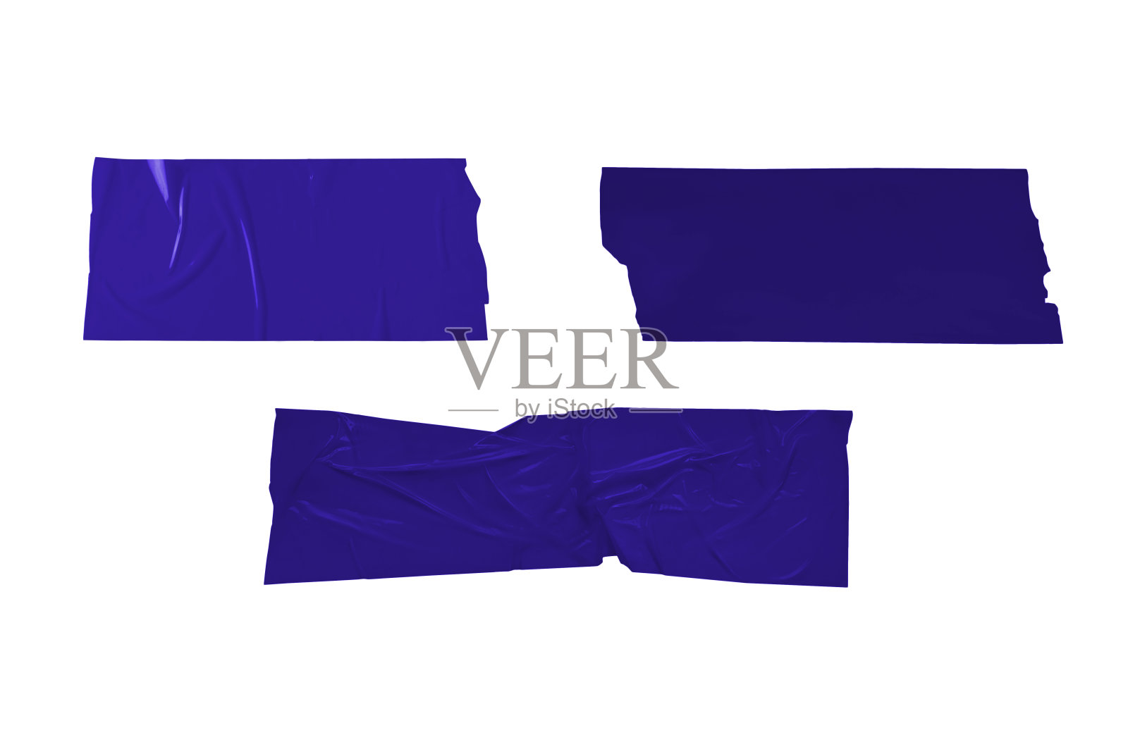 一套深蓝色的黄金撕碎的透明胶带在白色的背景。照片摄影图片