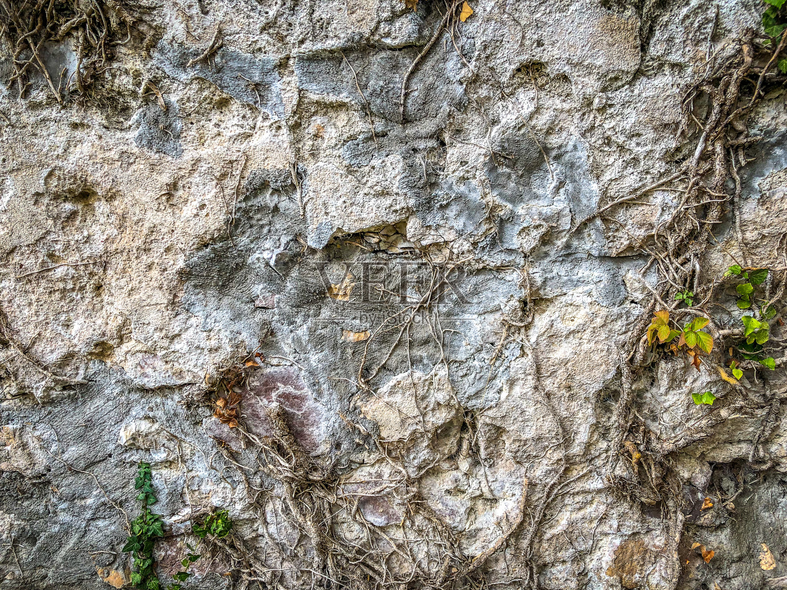 作为纹理或背景的石墙。照片摄影图片