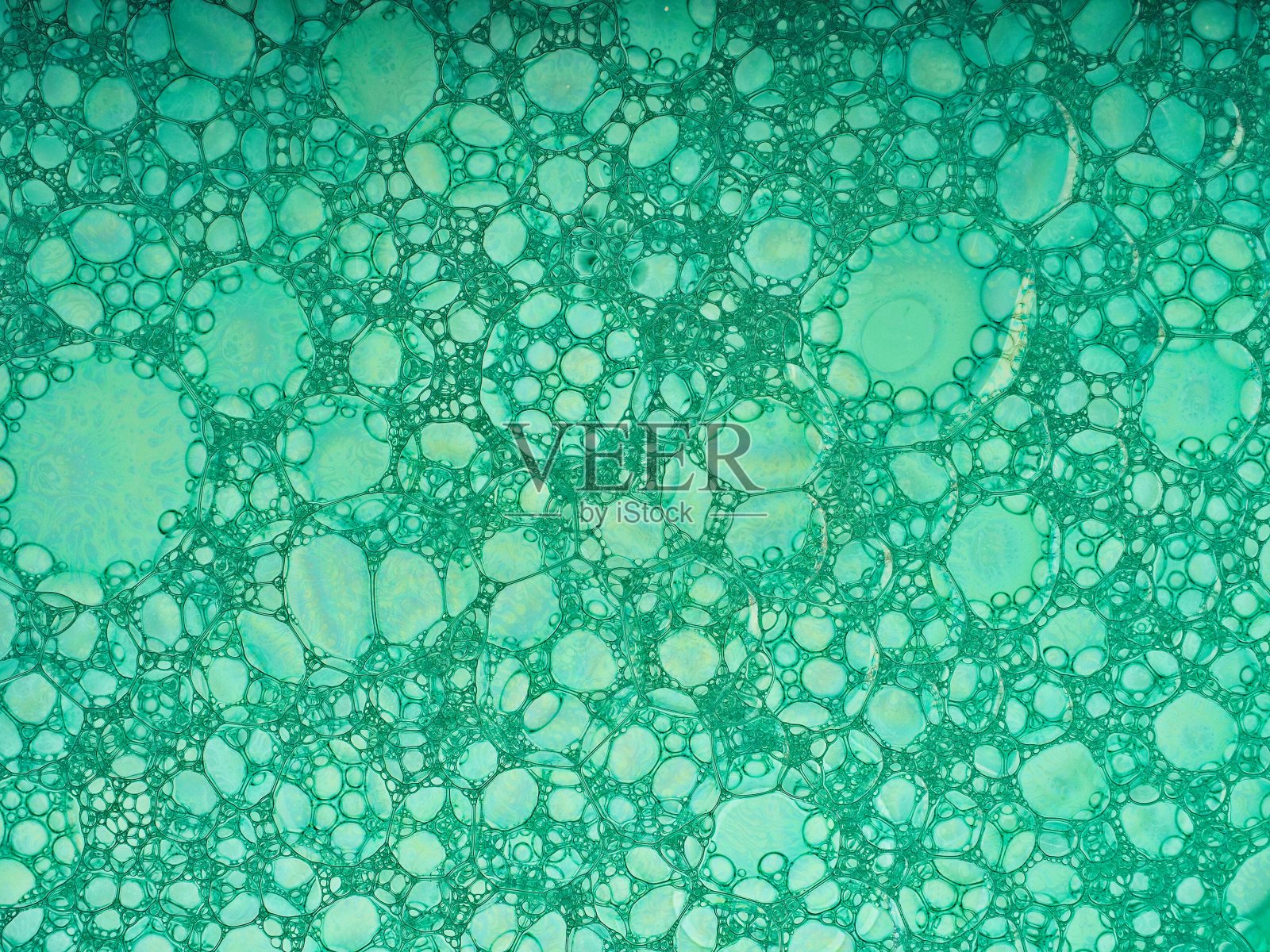 抽象的泡沫从后面明亮地照明与多种颜色的颜料理想的抽象背景描绘纹理，形状，形式，和鲜明的颜色照片摄影图片