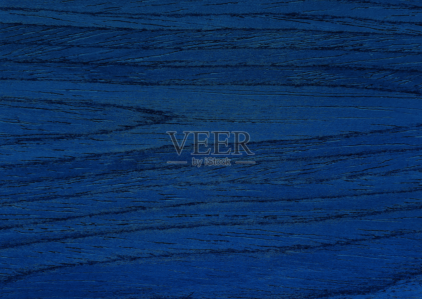 拉近奢华的蓝色胡桃木纹理背景，呈现出美丽的木纹。封闭饰面木材料完成工作。蓝色的木质纹理。照片摄影图片