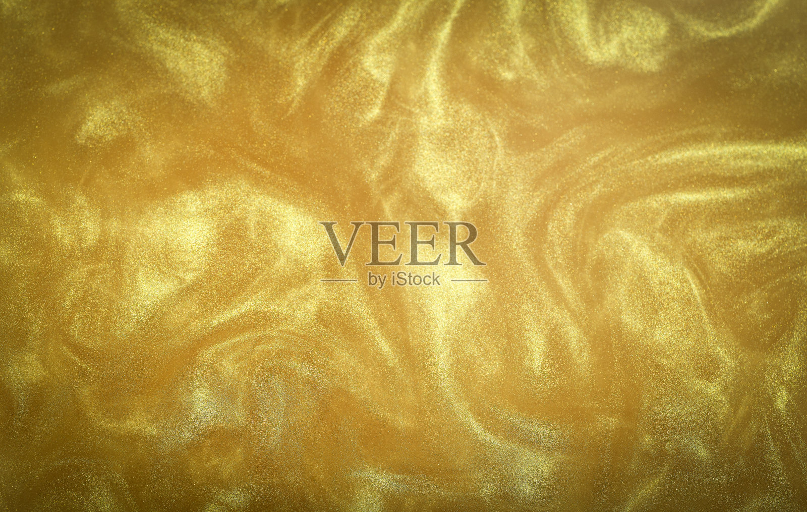 金色闪光抽象背景。迷人的金光闪闪的神奇明亮的节日背景的新年派对装饰照片摄影图片