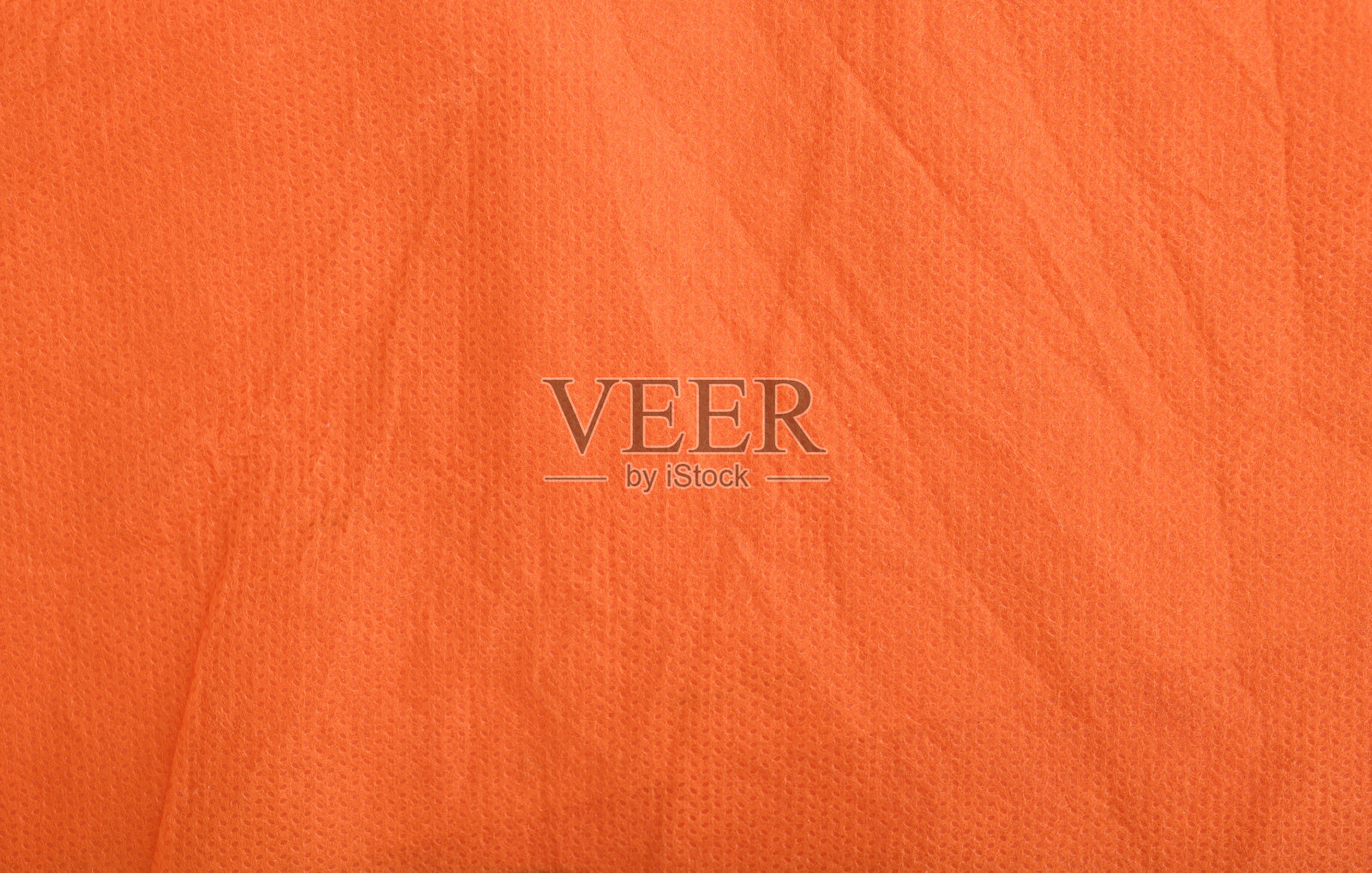 背景来自红色皱巴巴的织物。照片摄影图片