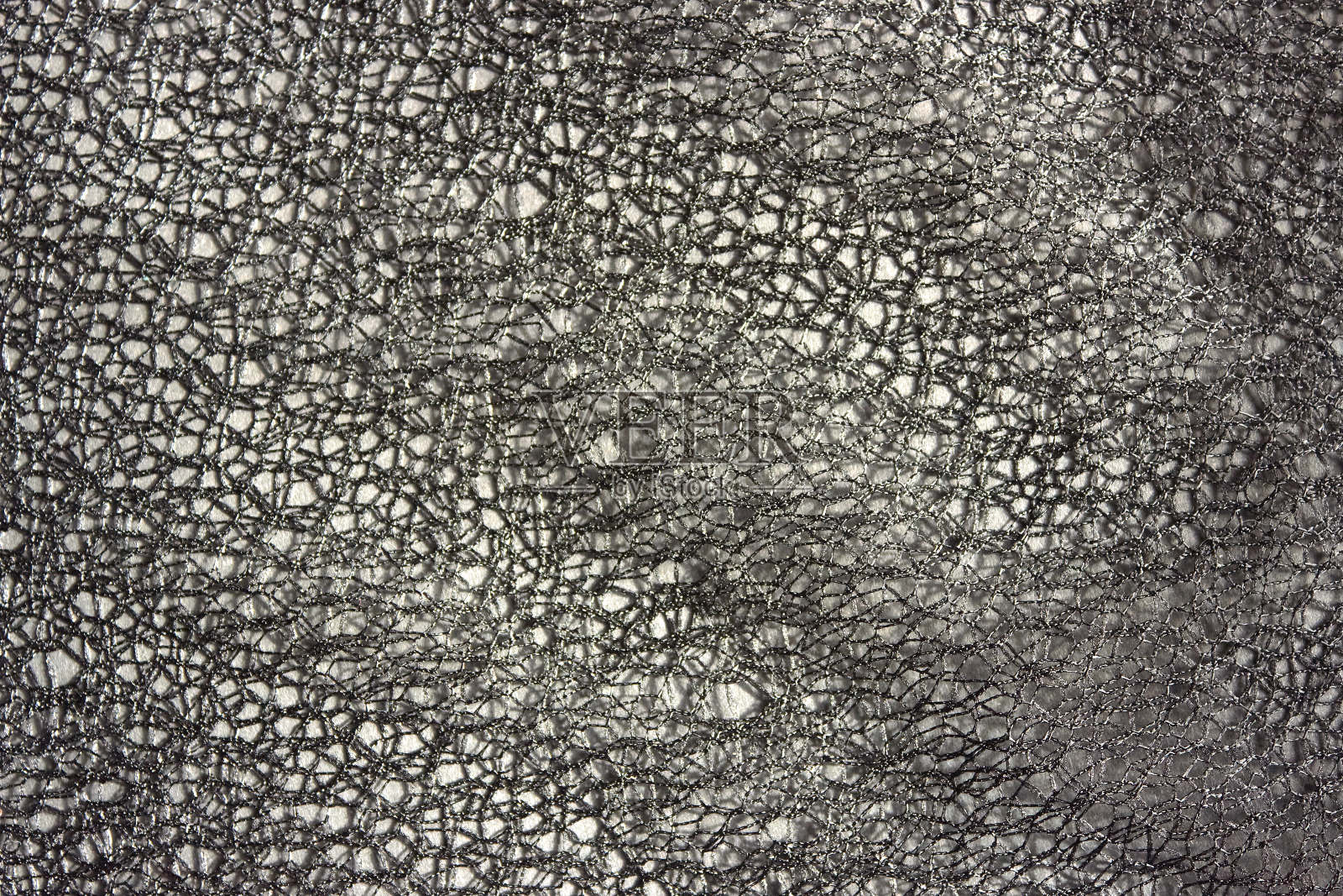 灰色蕾丝抽象背景。黑色背景设计，社交网络，文本。网眼，网眼，织物背景。照片摄影图片