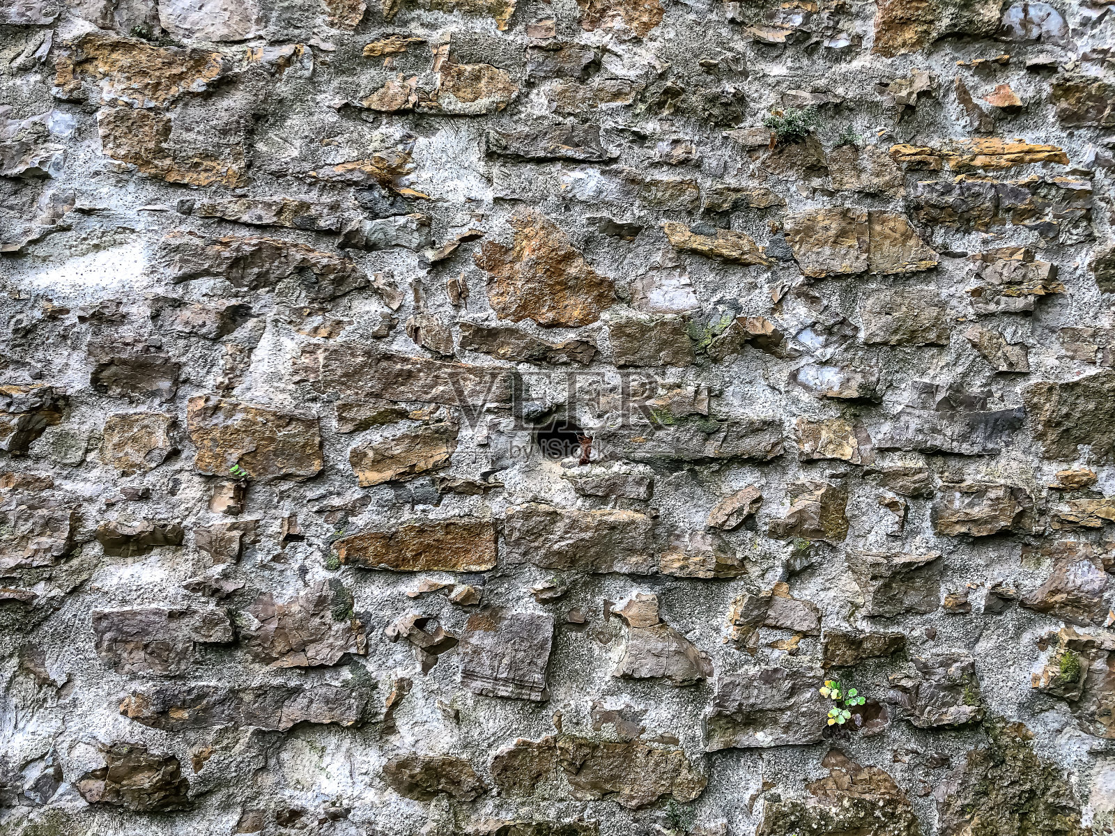 作为纹理或背景的石墙。照片摄影图片