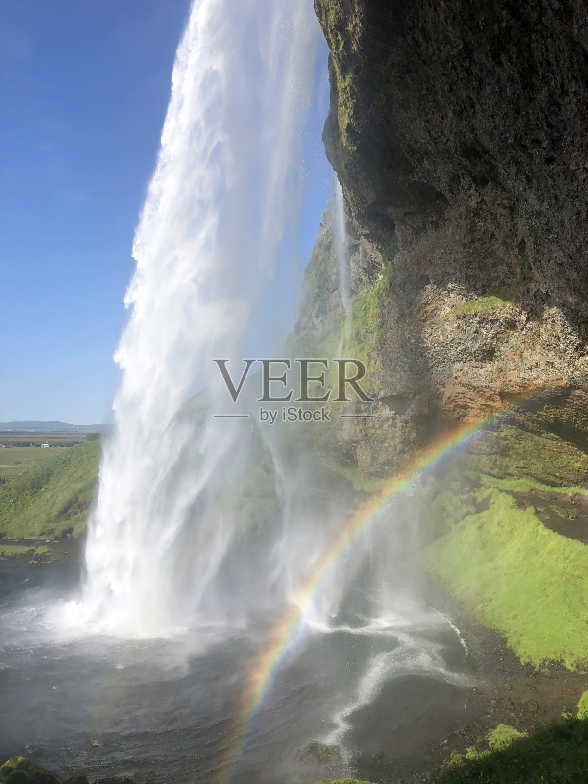 冰岛Seljalandsfoss瀑布前的彩虹照片摄影图片