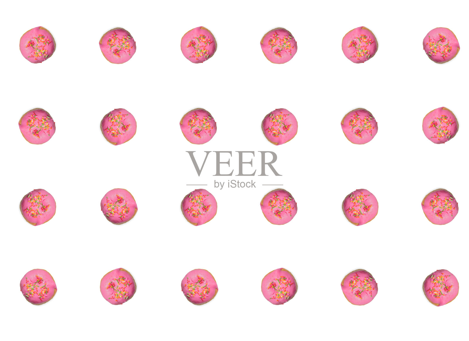 粉色甜甜圈的图案。多纳圈与彩色的洒孤立在白色的背景。平躺照片摄影图片