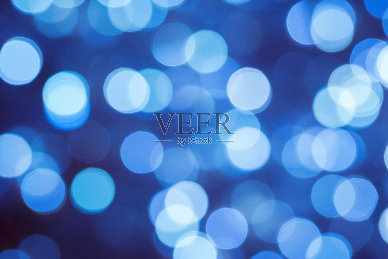 蓝色抽象的灯光散景模糊的圣诞背景照片摄影图片