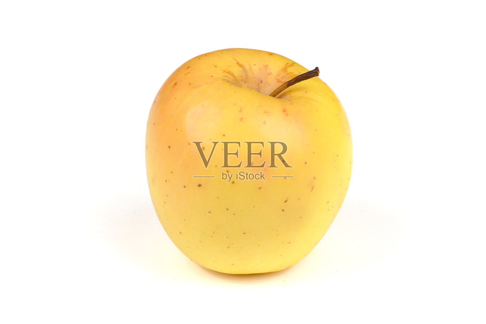 黄苹果离白。照片摄影图片