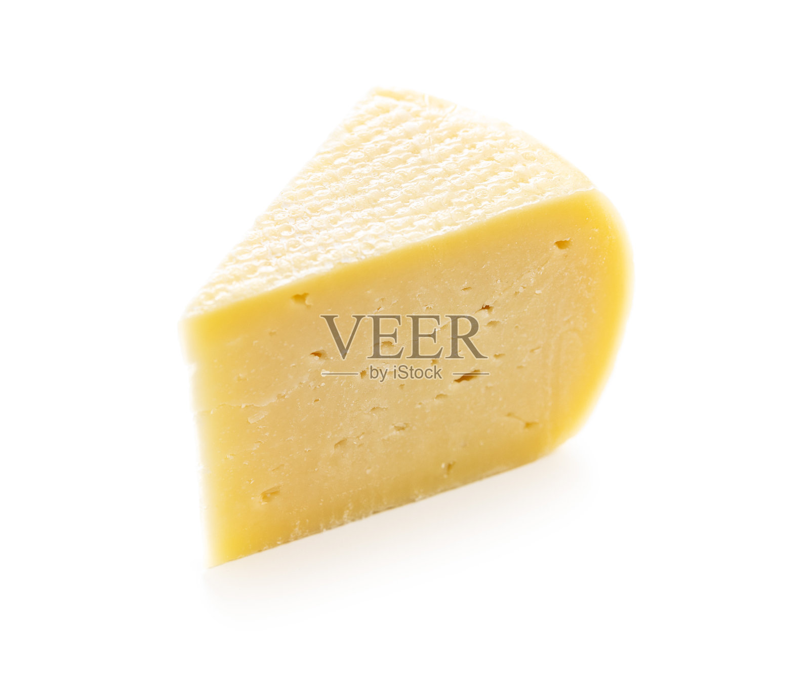 一块硬奶酪。照片摄影图片