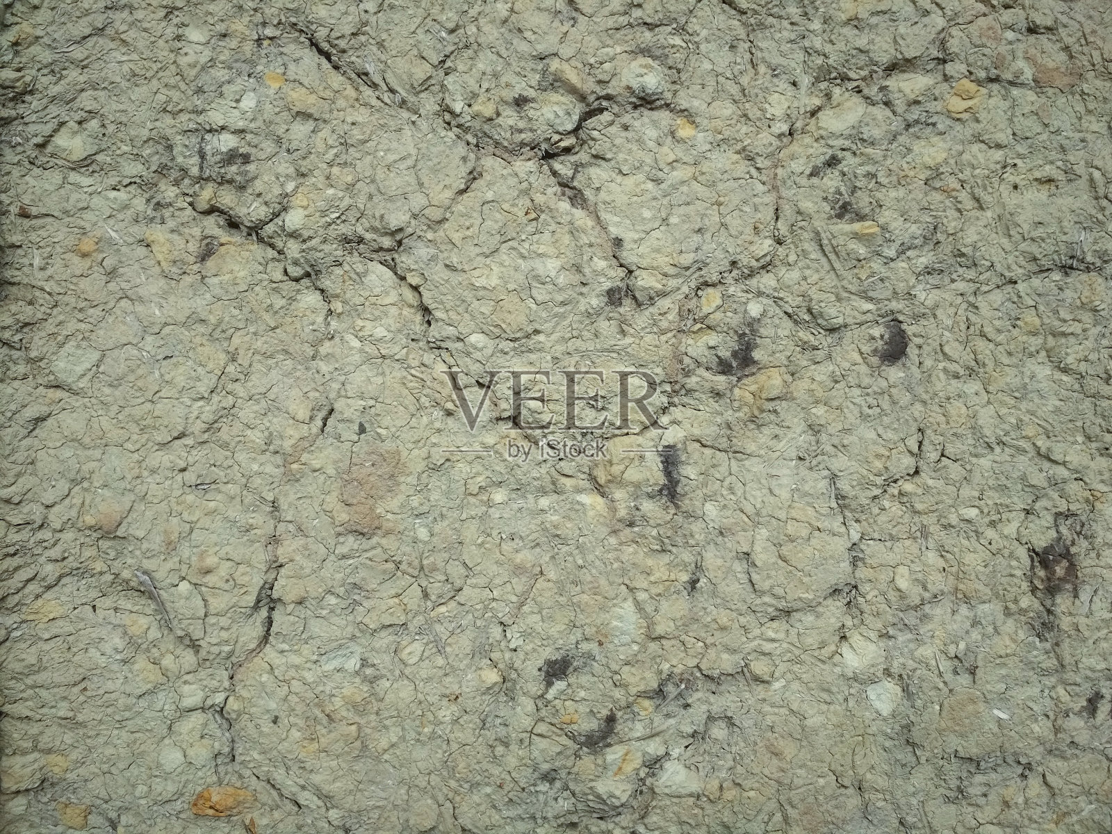 灰色破碎粘土岩的结构。有裂缝的粘土墙。照片摄影图片