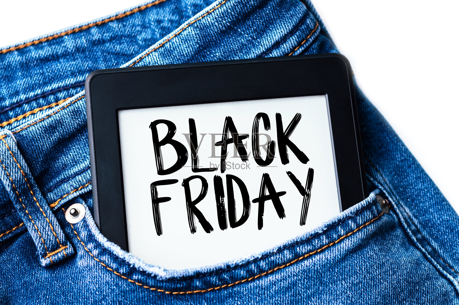 牛仔裤口袋里的平板电脑上有黑色星期五的标志照片摄影图片