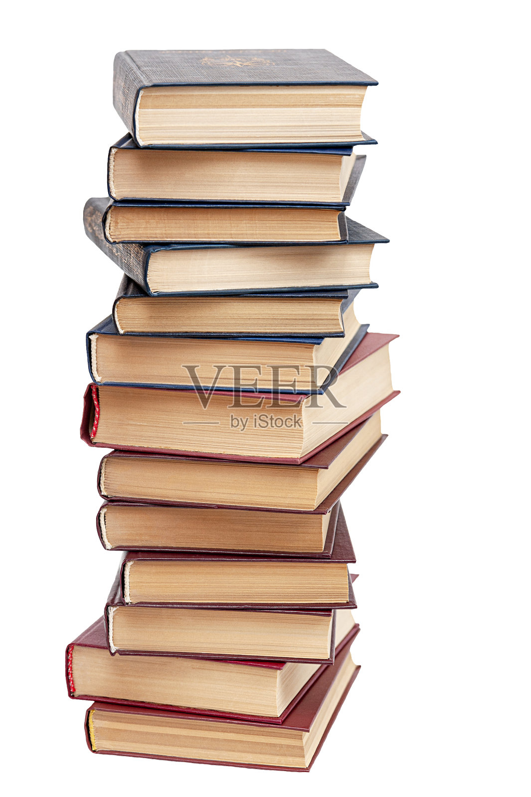 用白色背景上孤立的旧精装书组成。垂直的照片。回到学校。照片摄影图片