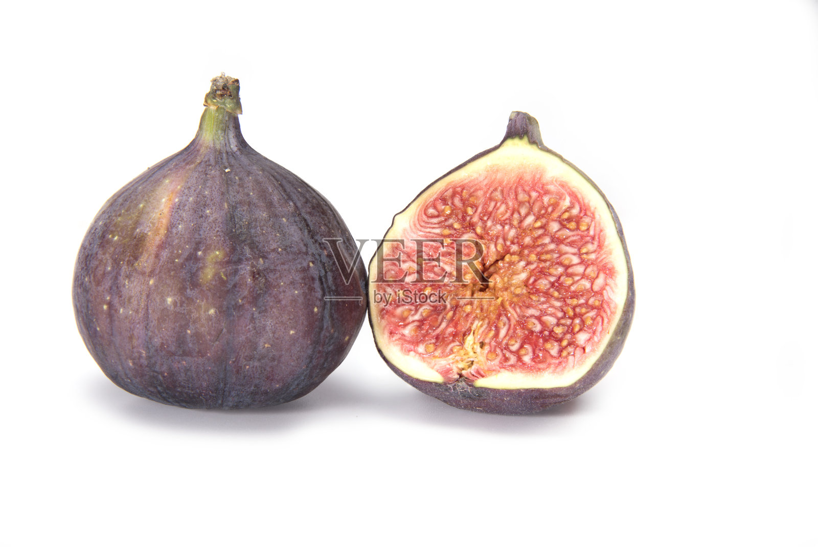 成熟无花果的特写一个切口显示里面照片摄影图片