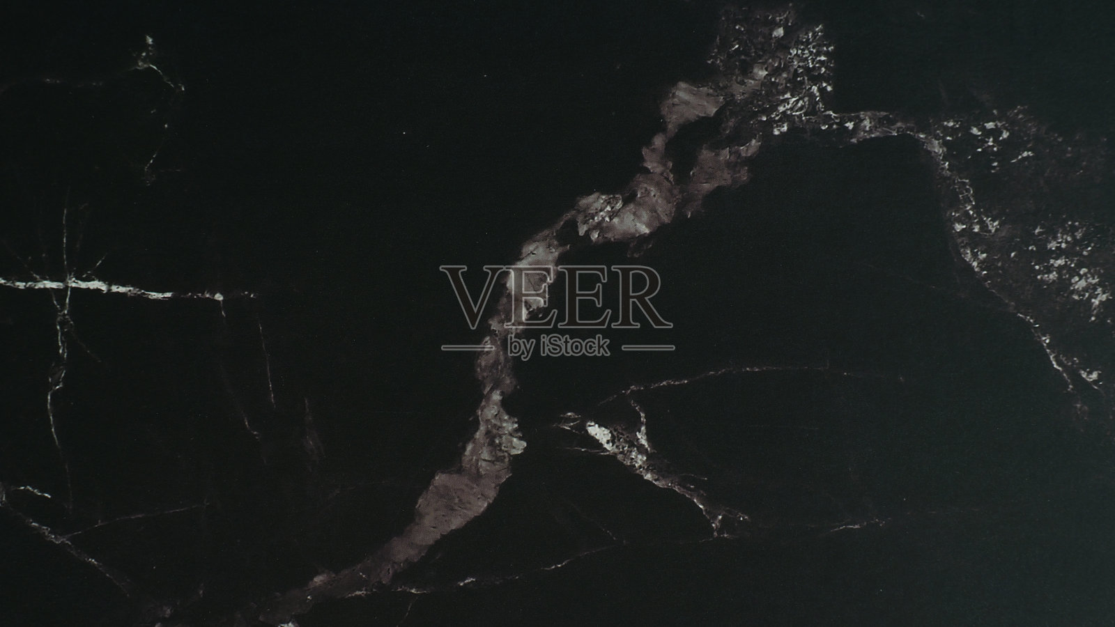 黑色大理石抽象背景和纹理。照片摄影图片