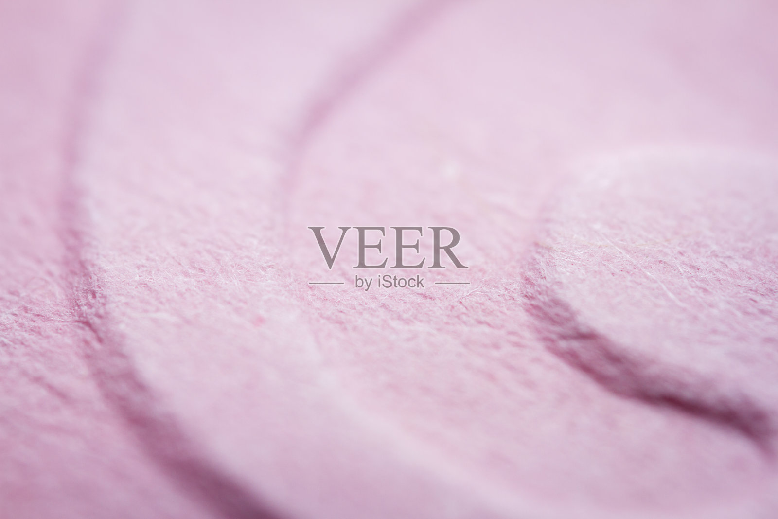 极端宏观的压花粉红纸照片摄影图片